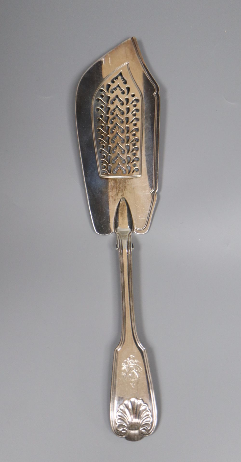 A late William IV silver fiddle, thread and shell pattern fish slice, Mary Chawner, London 1836, 32.5cm, 7.5oz.